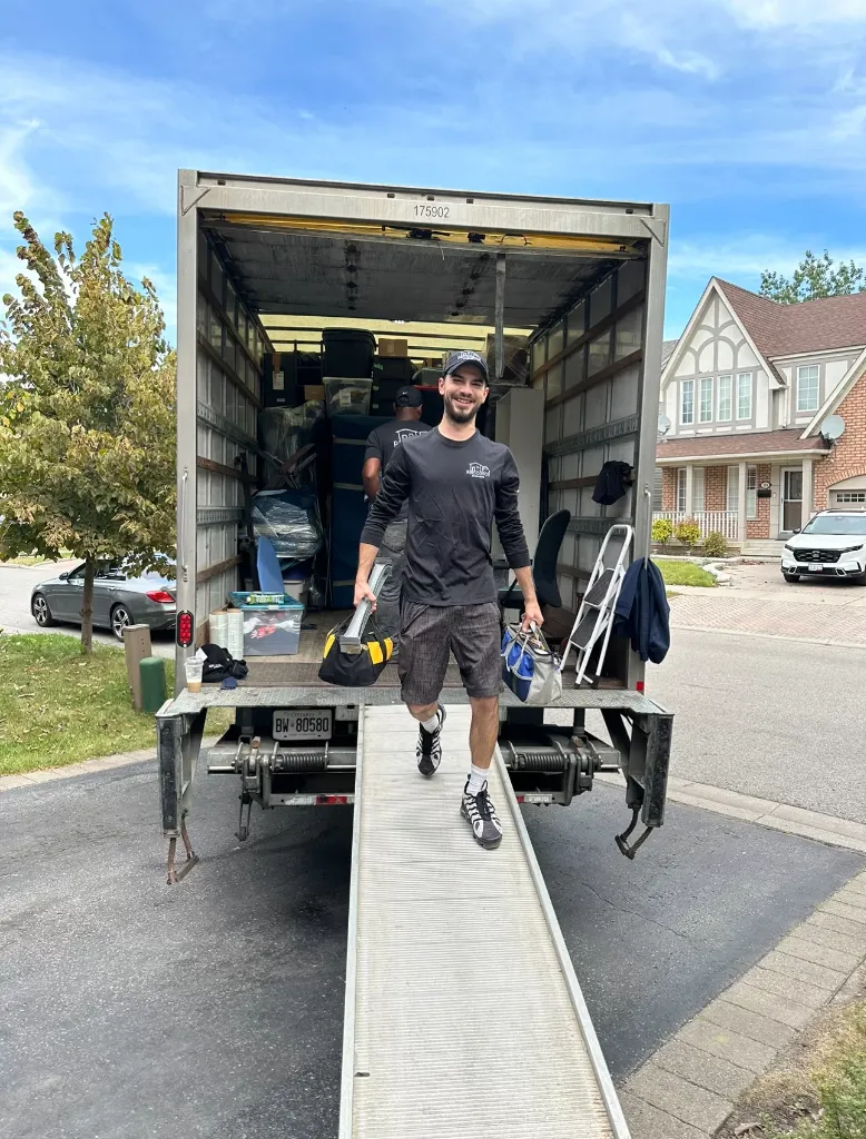 Uniformed Mover on Truck Ramp